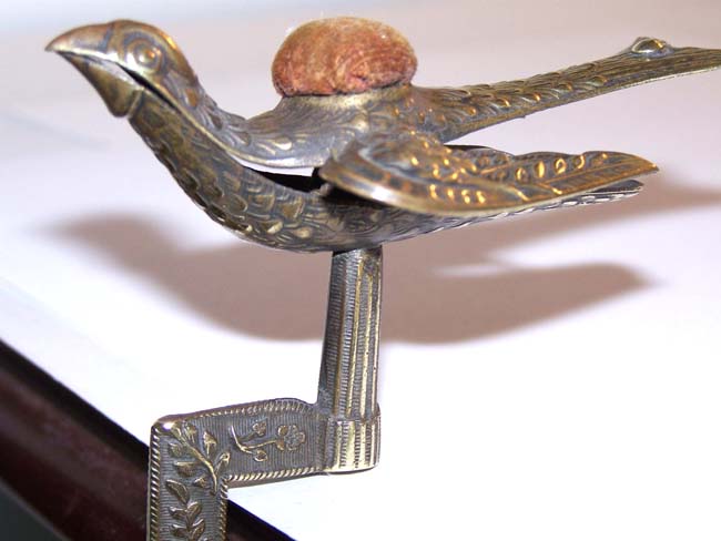 An American Brass Sewing Bird Clamp with pincushion circa 1853